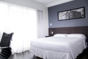 Postel nebo postele na pokoji v ubytování Flat com Varanda-Pampulha
