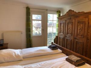 Ένα ή περισσότερα κρεβάτια σε δωμάτιο στο Gästehaus Villa Lina