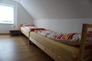מיטה או מיטות בחדר ב-König Ferienhaus