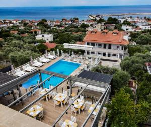 an aerial view of a villa with a swimming pool at Anny Residences & Suites in Skala Kallirachis