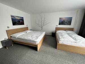Katil atau katil-katil dalam bilik di Hotel VARNSDORF