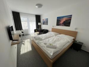 Katil atau katil-katil dalam bilik di Hotel VARNSDORF