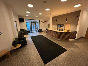 Televisyen dan/atau pusat hiburan di Hotel VARNSDORF