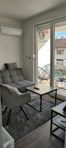 a living room with a couch and a coffee table at Perfect Place 32 in Varaždin