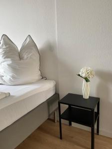 Postel nebo postele na pokoji v ubytování Hegau Boardinghouse