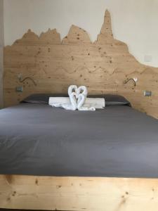 Posteľ alebo postele v izbe v ubytovaní Appartamento Profumo di Legno 022139-AT-010022