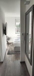 a room with a mirror and a bed in it at Perfect Place 32 in Varaždin