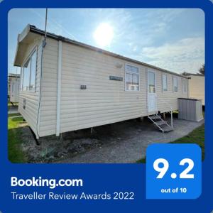 a trailer review awards with a picture of a caravan at Cozy Private Static Caravan at Llyons Robin Hood - Silver Birch Way 11 in Rhyl