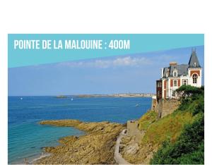 a house on a cliff next to the ocean at Homard and Fox, Appartement 2 chambres 100m de la mer in Dinard