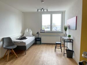Postel nebo postele na pokoji v ubytování Hegau Boardinghouse