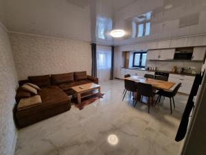 a large living room with a couch and a table at Apartmán Žora in Dražov