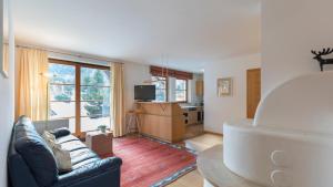 a living room with a couch and a table at Residence Königswarte Strata in Sesto