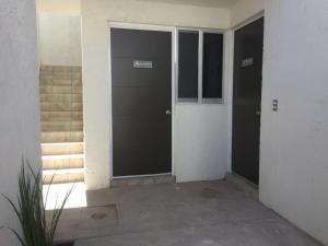an empty room with two entrances to a building at CASA COLON in Aguascalientes