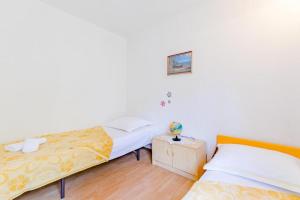 Postel nebo postele na pokoji v ubytování Apartment Duje