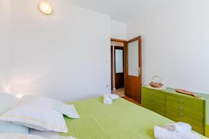 Postel nebo postele na pokoji v ubytování Apartment Duje