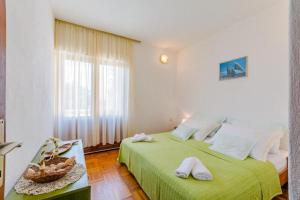 Postel nebo postele na pokoji v ubytování Apartment Duje