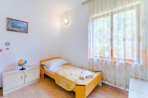 Postel nebo postele na pokoji v ubytování Apartment Duje