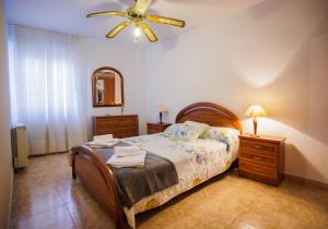 Tempat tidur dalam kamar di EL HOGAR DEL HERRERO