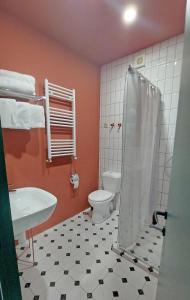 a bathroom with a toilet and a sink and a shower at Gudauri Roshka Studio Apt #412 in Gudauri