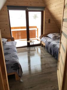 Кровать или кровати в номере Domki Na Stoku