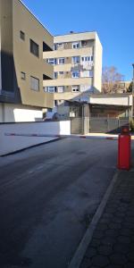 an empty street in front of a large building at Perfect Place 32 in Varaždin