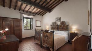 A bed or beds in a room at Casale Scola Cetona