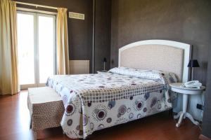 Postel nebo postele na pokoji v ubytování Hotel Paclà