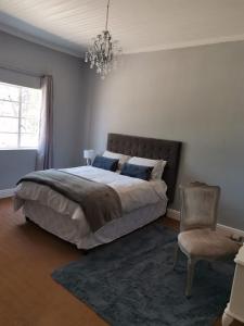 Ένα ή περισσότερα κρεβάτια σε δωμάτιο στο Hartland Gastehuis/Guesthouse