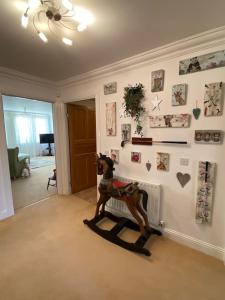 a room with a statue of a horse on the floor at Central St Andrews 2 bed apartment in St. Andrews