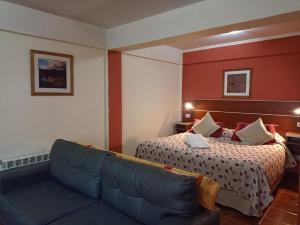 Ένα ή περισσότερα κρεβάτια σε δωμάτιο στο Apart Hotel Cabo San Diego