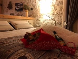 Un pat sau paturi într-o cameră la Il nido del pettirosso