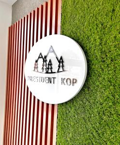 a white frisbee sitting on top of grass at PresidentKop LUX Wellness & SPA Apartments in Kopaonik