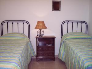 A bed or beds in a room at B&B Tramonto d'Oro
