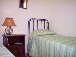 A bed or beds in a room at B&B Tramonto d'Oro