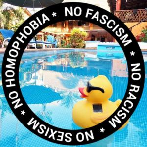 a rubber duck sitting in front of a swimming pool at Hotelito Swiss Oasis - Solo Adultos in Puerto Escondido