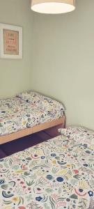 מיטה או מיטות בחדר ב-APARTAMENTO EN PUNTA UMBRÍA