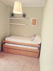 Łóżko lub łóżka w pokoju w obiekcie APARTAMENTO EN PUNTA UMBRÍA