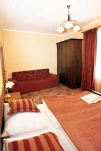 Voodi või voodid majutusasutuse Hotel Pelikán toas