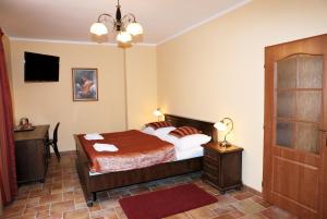 Voodi või voodid majutusasutuse Hotel Pelikán toas
