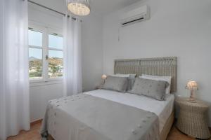 מיטה או מיטות בחדר ב-Vitalis Residences - Rural Living