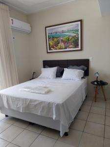 A bed or beds in a room at Flat beira mar, Olinda 4 Rodas 315