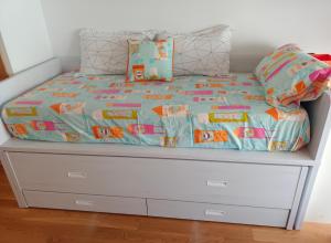 A bed or beds in a room at maravilloso apartamento en la playa...muy especial