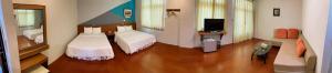 Postel nebo postele na pokoji v ubytování Coast Shan Shui B&B