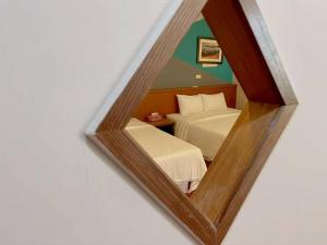 Postel nebo postele na pokoji v ubytování Coast Shan Shui B&B