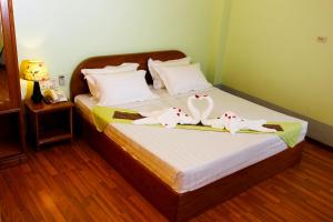 Postel nebo postele na pokoji v ubytování Sandalwood Hotel