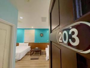 Postel nebo postele na pokoji v ubytování Coast Shan Shui B&B