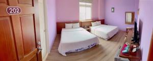 A bed or beds in a room at Coast Shan Shui B&B