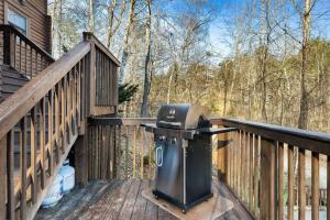 a grill on the deck of a house at Mama Bear's Retreat in Sevierville