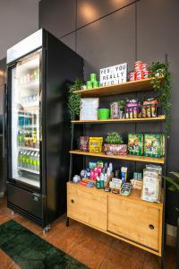 a refrigerator filled with lots of different types of food at Holiday Inn Sydney Airport, an IHG Hotel in Sydney