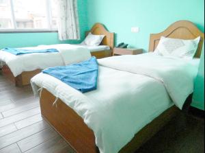 Letto o letti in una camera di Mount Annapurna Guest House
